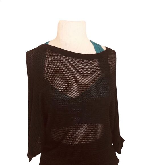 Black dolman sleeve gathers at waist line. This top it has small peekaboo holes. - Picture 3 of 3